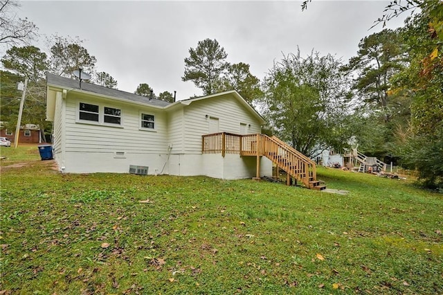 51 Ezzard St, Lawrenceville, GA 30046 - rear view of property featuring stairway, a lawn, a wooden deck, and central AC
