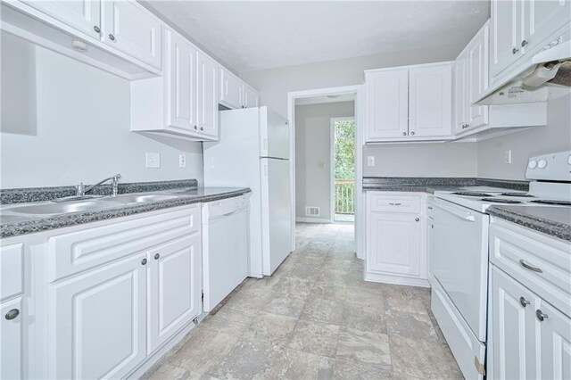 51 Ezzard St, Lawrenceville, GA 30046 - kitchen featuring white appliances, a sink, dark countertops, and white cabinetry