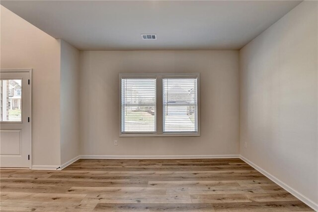 58 Longhorn Way, Auburn, GA 30011 - unfurnished room featuring baseboards, visible vents, and wood finished floors