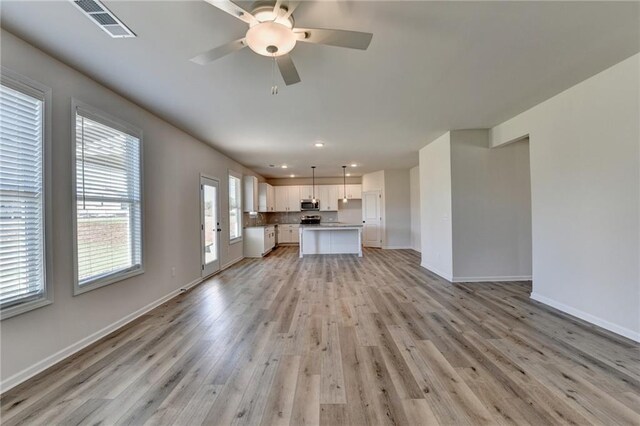 58 Longhorn Way, Auburn, GA 30011 - unfurnished living room with visible vents, recessed lighting, light wood-style flooring, and baseboards