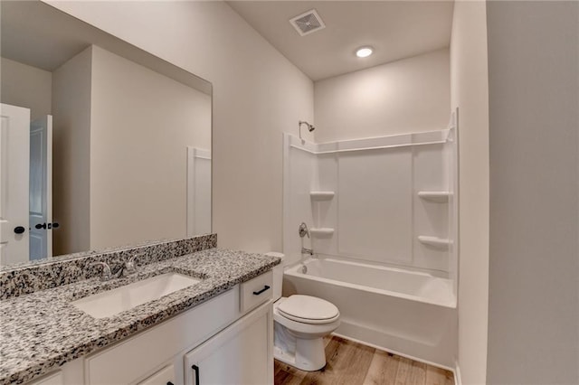 58 Longhorn Way, Auburn, GA 30011 - bathroom with visible vents, vanity, wood finished floors, toilet, and shower / bath combination