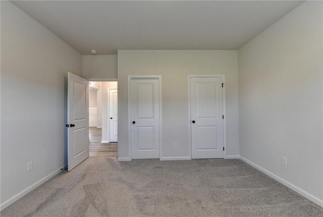 58 Longhorn Way, Auburn, GA 30011 - unfurnished bedroom featuring baseboards and light carpet