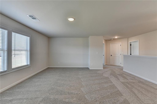 58 Longhorn Way, Auburn, GA 30011 - spare room with baseboards, light carpet, recessed lighting, and visible vents