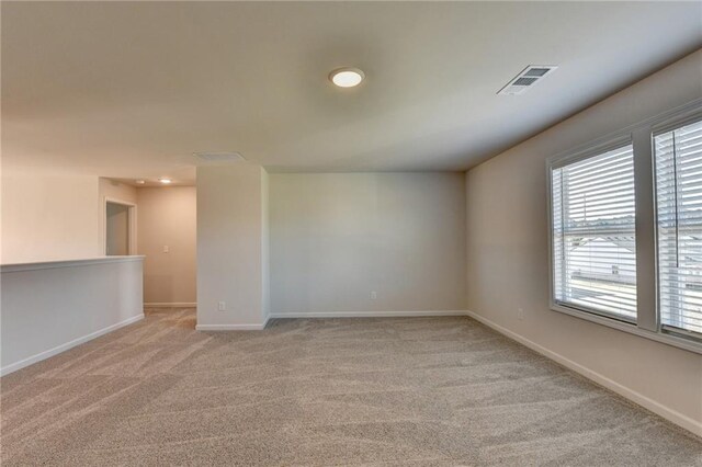 58 Longhorn Way, Auburn, GA 30011 - spare room with baseboards, light colored carpet, recessed lighting, and visible vents