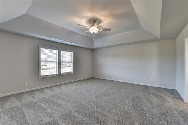 58 Longhorn Way, Auburn, GA 30011 - empty room with baseboards, a ceiling fan, a raised ceiling, and carpet