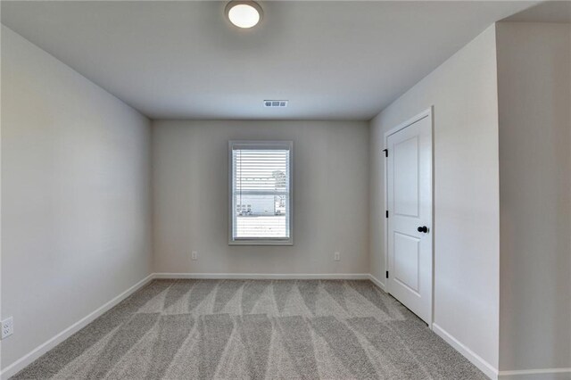 58 Longhorn Way, Auburn, GA 30011 - empty room featuring baseboards, light carpet, and visible vents