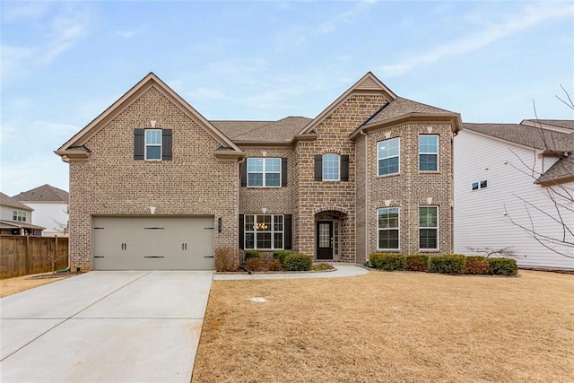 view of front of home with a garage and a front lawn