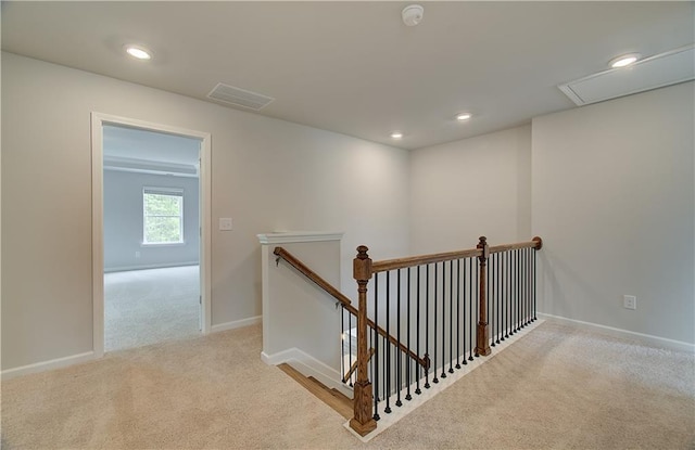 staircase featuring recessed lighting, visible vents, baseboards, and carpet floors