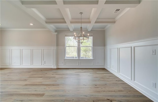 unfurnished dining area with visible vents, a notable chandelier, a decorative wall, light wood-type flooring, and beamed ceiling