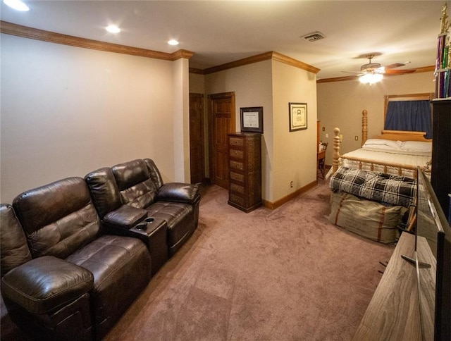 home theater room featuring carpet flooring, ceiling fan, and ornamental molding