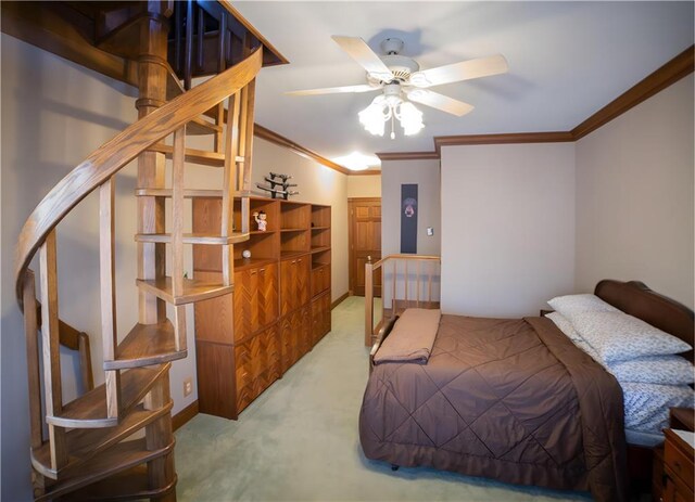 bedroom with ceiling fan, crown molding, and light colored carpet