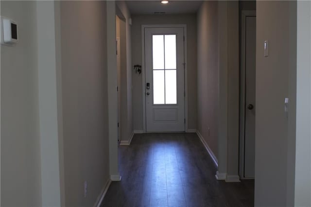 doorway to outside with dark hardwood / wood-style floors