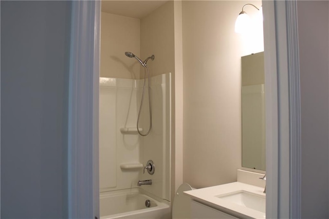 full bathroom with vanity,  shower combination, and toilet