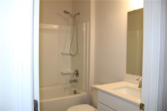 full bathroom featuring washtub / shower combination, vanity, and toilet