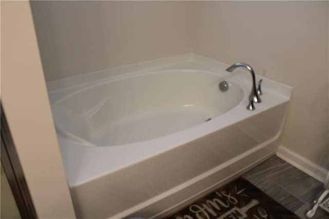 bathroom featuring a tub to relax in