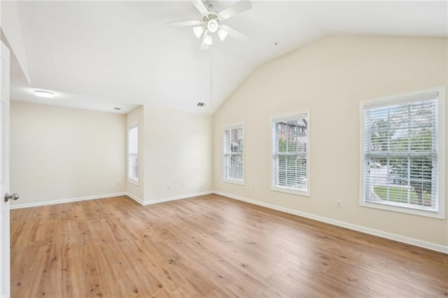 unfurnished room featuring vaulted ceiling, light hardwood / wood-style floors, and ceiling fan