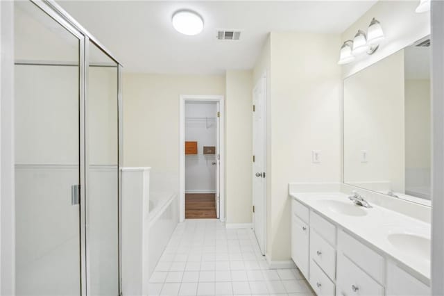 bathroom with vanity, separate shower and tub, and tile patterned floors