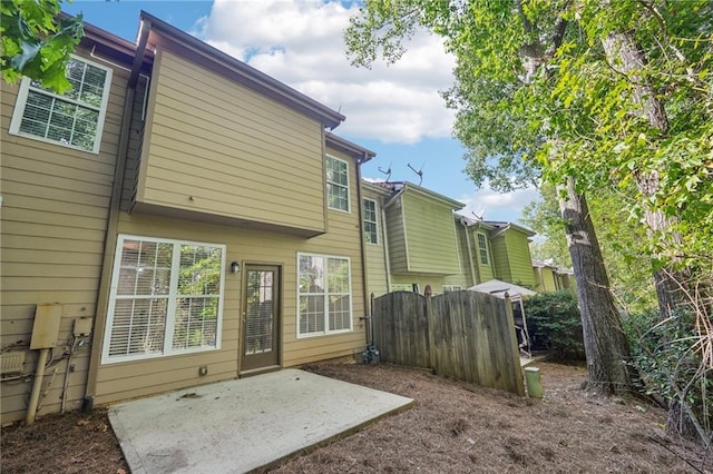 back of house with a patio area