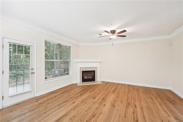 unfurnished living room with ornamental molding, ceiling fan, and light hardwood / wood-style flooring