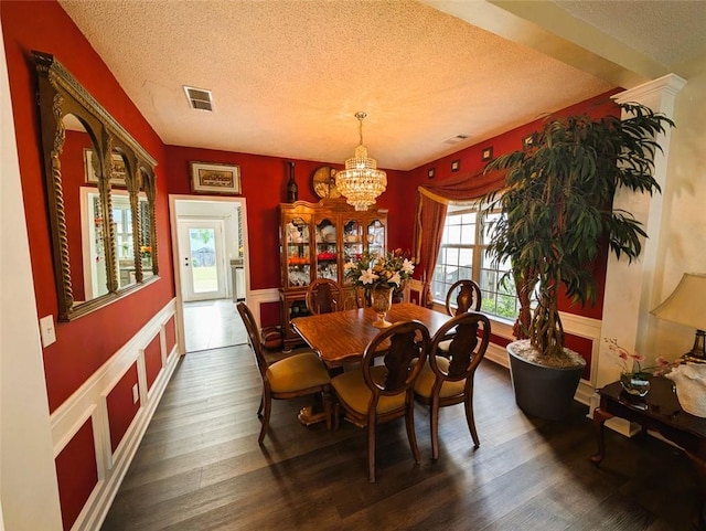 640 Dahoma Trl, Woodstock, GA 30188 - dining space with a textured ceiling, a chandelier, and wood finished floors
