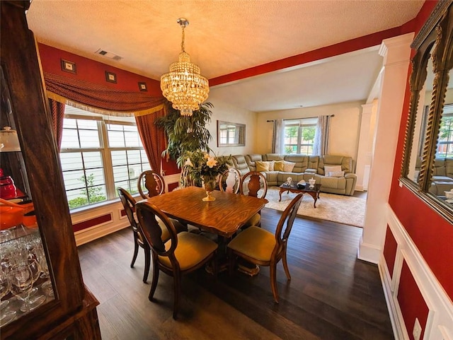 640 Dahoma Trl, Woodstock, GA 30188 - dining area with a chandelier, dark wood-type flooring, and a textured ceiling