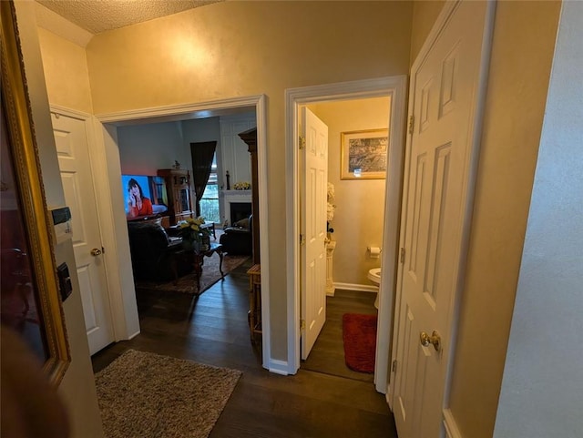 640 Dahoma Trl, Woodstock, GA 30188 - corridor with dark wood finished floors and a textured ceiling