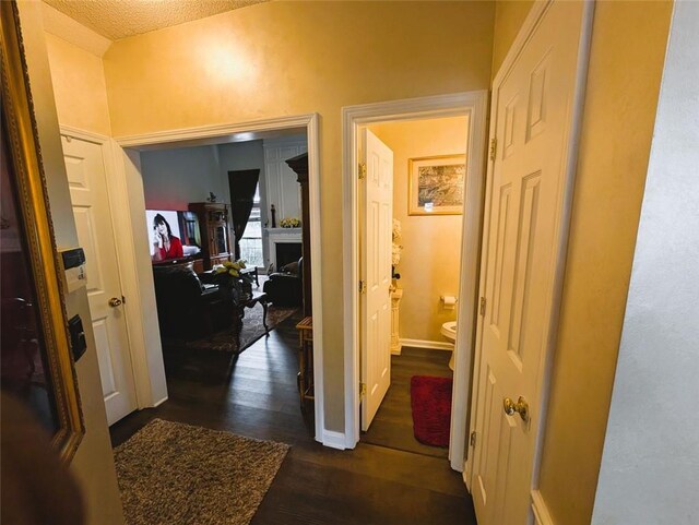 640 Dahoma Trl, Woodstock, GA 30188 - hall featuring dark wood finished floors and a textured ceiling