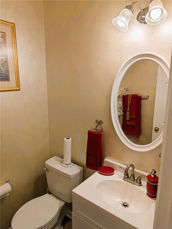 640 Dahoma Trl, Woodstock, GA 30188 - half bath featuring toilet and vanity