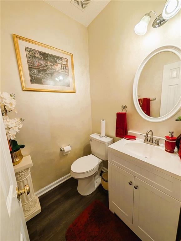 640 Dahoma Trl, Woodstock, GA 30188 - half bathroom featuring wood finished floors and vanity
