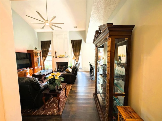 640 Dahoma Trl, Woodstock, GA 30188 - living room with a ceiling fan, dark wood-style flooring, and a fireplace