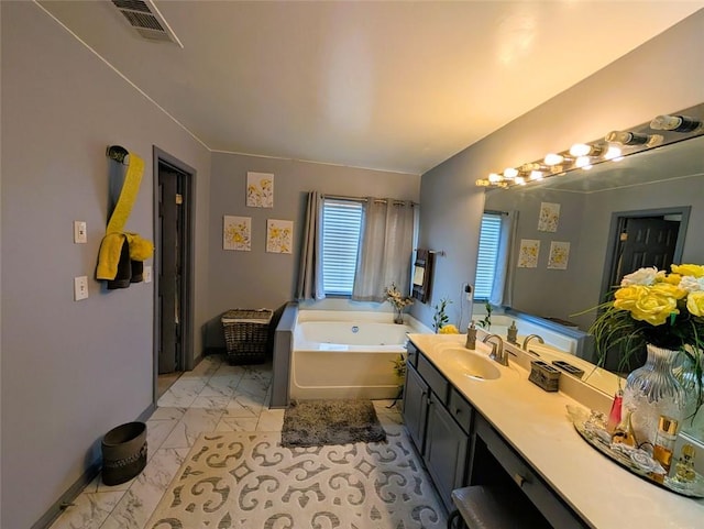 640 Dahoma Trl, Woodstock, GA 30188 - bathroom with marble finish flooring, a bath, and vanity