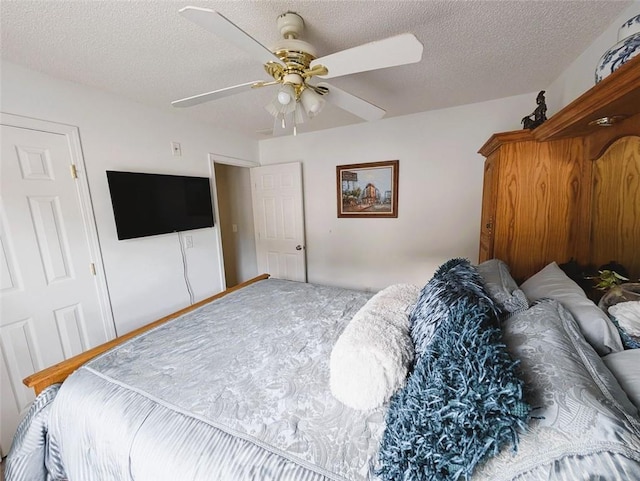 640 Dahoma Trl, Woodstock, GA 30188 - bedroom featuring a textured ceiling and a ceiling fan