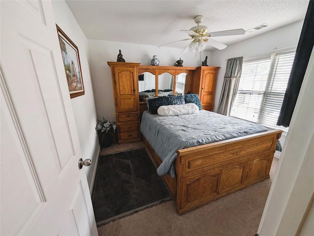 640 Dahoma Trl, Woodstock, GA 30188 - bedroom with light colored carpet, a textured ceiling, and ceiling fan