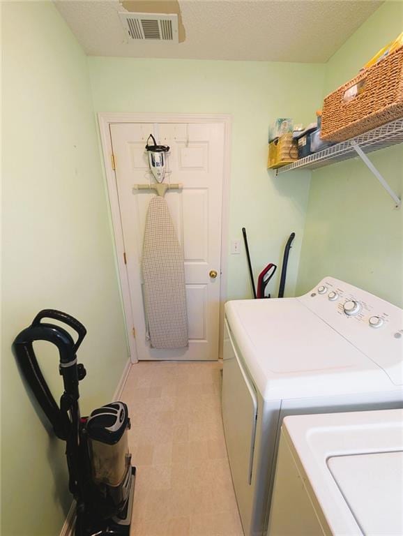 640 Dahoma Trl, Woodstock, GA 30188 - laundry area featuring washing machine and dryer and baseboards