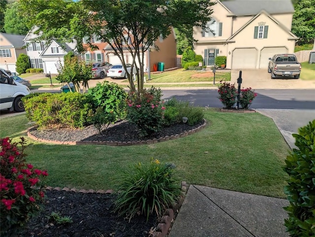 640 Dahoma Trl, Woodstock, GA 30188 - view of green lawn with asphalt driveway and an attached garage