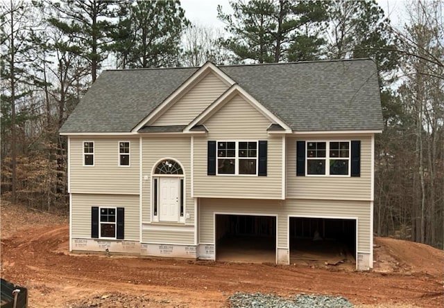 raised ranch featuring a garage