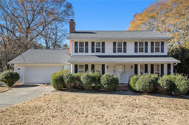 view of front of house with a garage and covered porch