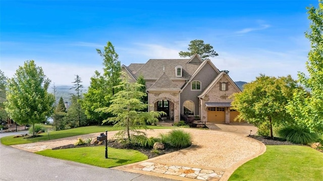 89 Somerset Ln, Cartersville, GA 30121 - french provincial home with a front yard, brick siding, and curved driveway