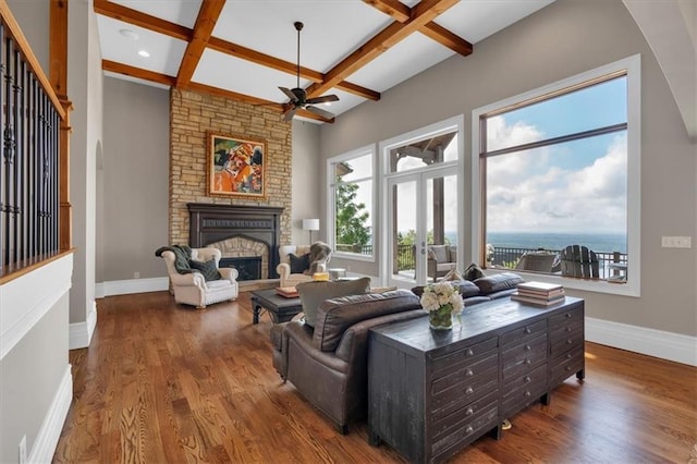 89 Somerset Ln, Cartersville, GA 30121 - living area featuring ceiling fan, beamed ceiling, baseboards, coffered ceiling, and a large fireplace