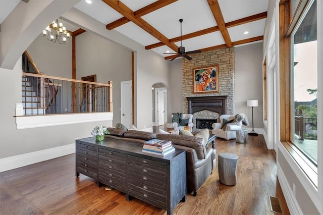 89 Somerset Ln, Cartersville, GA 30121 - living area with arched walkways, coffered ceiling, a ceiling fan, stairway, and wood finished floors