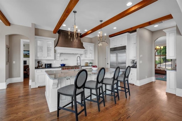 89 Somerset Ln, Cartersville, GA 30121 - kitchen featuring arched walkways, a chandelier, beam ceiling, stainless steel built in fridge, and baseboards