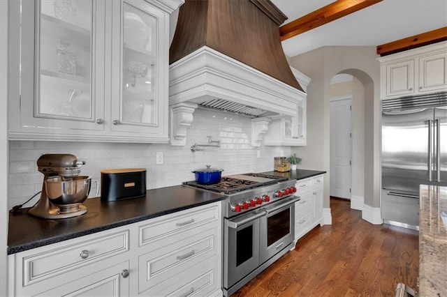 89 Somerset Ln, Cartersville, GA 30121 - kitchen with high end appliances, premium range hood, beam ceiling, tasteful backsplash, and white cabinets