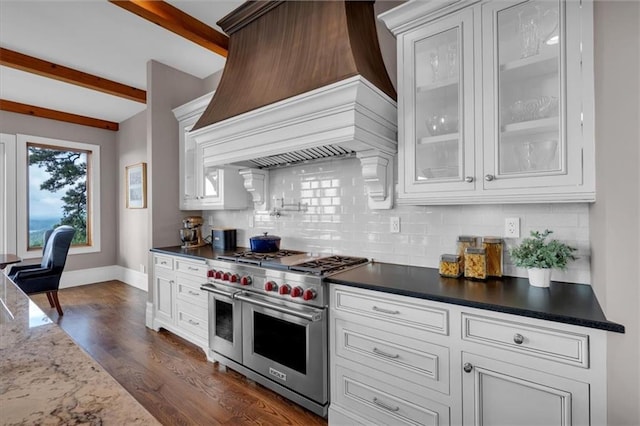 89 Somerset Ln, Cartersville, GA 30121 - kitchen featuring range with two ovens, custom range hood, backsplash, beam ceiling, and baseboards