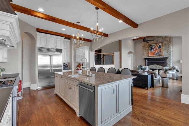 89 Somerset Ln, Cartersville, GA 30121 - kitchen with a sink, high end appliances, ceiling fan, arched walkways, and recessed lighting