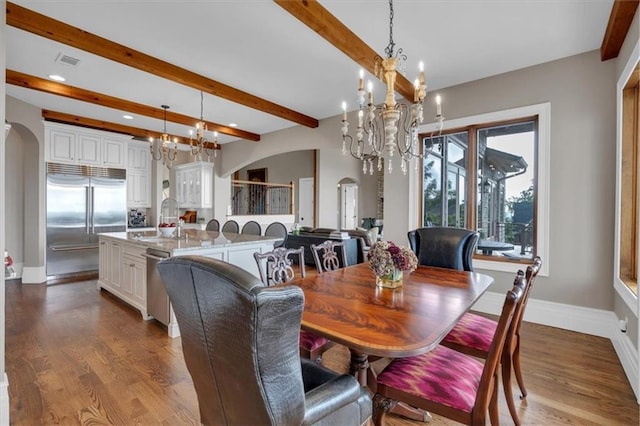 89 Somerset Ln, Cartersville, GA 30121 - dining room with arched walkways, a chandelier, beam ceiling, recessed lighting, and dark wood-style flooring