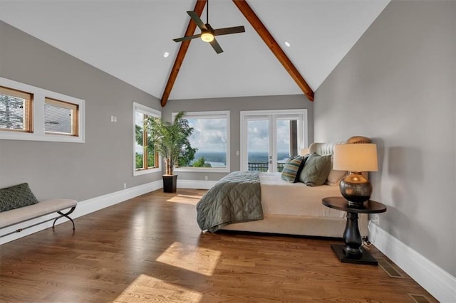 89 Somerset Ln, Cartersville, GA 30121 - bedroom featuring access to exterior, beam ceiling, baseboards, wood finished floors, and high vaulted ceiling