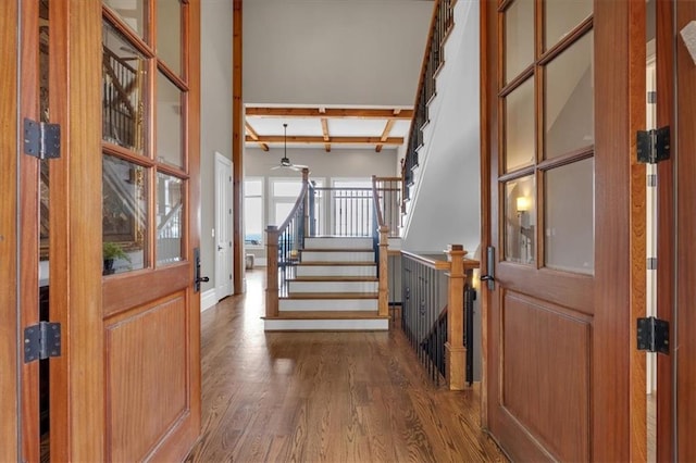 89 Somerset Ln, Cartersville, GA 30121 - entrance foyer with wood finished floors, stairs, beamed ceiling, and baseboards