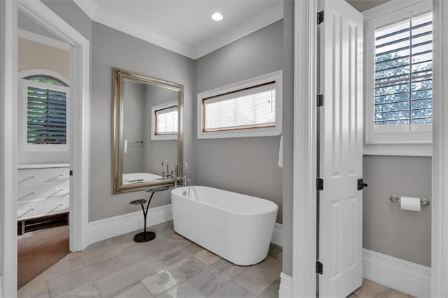 89 Somerset Ln, Cartersville, GA 30121 - full bath with a freestanding tub, healthy amount of natural light, baseboards, and crown molding