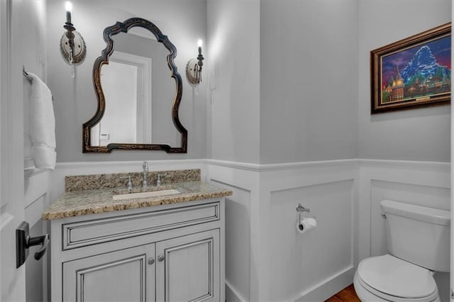 89 Somerset Ln, Cartersville, GA 30121 - bathroom with toilet, vanity, and wainscoting