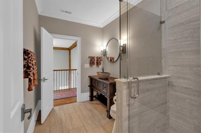 89 Somerset Ln, Cartersville, GA 30121 - bathroom with vanity, a shower stall, crown molding, toilet, and baseboards